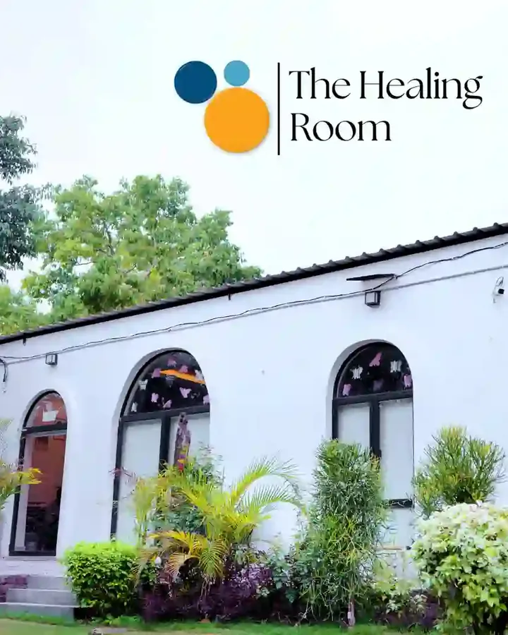 The Healing Room building in Bijwasan, New Delhi, with its arched windows and garden
